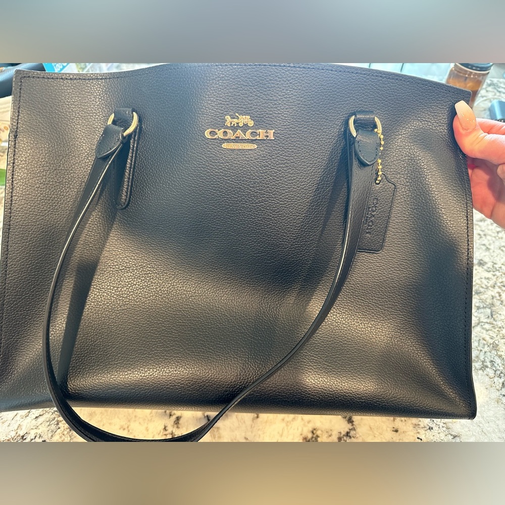 Black and red authentic Coach bag. Fits standard laptop. Perfect condition.